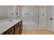 Bright bathroom offers double sink vanity, soaking tub, and separate shower stall at 3809 Alpine Track Ave, North Las Vegas, NV 89032