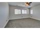 Neutral bedroom features gray carpet, white walls, and a window to the outside at 3809 Alpine Track Ave, North Las Vegas, NV 89032