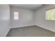 Neutral bedroom features gray carpet, white walls, and a window to the outside at 3809 Alpine Track Ave, North Las Vegas, NV 89032