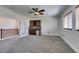 Cozy bonus room upstairs with carpet flooring, ceiling fan, and bar area at 3809 Alpine Track Ave, North Las Vegas, NV 89032