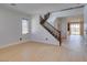Bright entryway with staircase featuring wood handrail and an open concept design at 3809 Alpine Track Ave, North Las Vegas, NV 89032