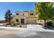 Charming two-story home featuring a well-manicured yard and a spacious two-car garage at 3809 Alpine Track Ave, North Las Vegas, NV 89032
