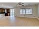 Bright living room with hardwood floors and modern ceiling fan offers an open concept living space at 3809 Alpine Track Ave, North Las Vegas, NV 89032