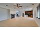 Spacious living room featuring hardwood floors, a fireplace, and an open floor plan to the kitchen at 3809 Alpine Track Ave, North Las Vegas, NV 89032
