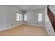 Well-lit room featuring three large windows and hardwood flooring at 3809 Alpine Track Ave, North Las Vegas, NV 89032