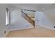 Second floor staircase featuring wood handrail and an open concept design at 3809 Alpine Track Ave, North Las Vegas, NV 89032