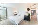 Bright bedroom featuring a queen size bed, carpet, and a black accent table at 4129 Chamisa Cove St, Las Vegas, NV 89115