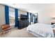 Inviting bedroom with soft carpet, dresser, and a window offering natural light at 4129 Chamisa Cove St, Las Vegas, NV 89115