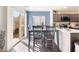 Cozy dining area with a sliding glass door, access to the patio, and an adjacent kitchen at 4129 Chamisa Cove St, Las Vegas, NV 89115