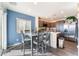 Bright eat-in kitchen with stainless steel appliances, gray dining set, and lots of storage at 4129 Chamisa Cove St, Las Vegas, NV 89115