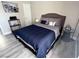 Well-lit bedroom featuring neutral tones, wood-look floors, and modern furnishings at 4200 S Valley View Blvd # 3078, Las Vegas, NV 89103