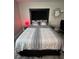 Modern bedroom with contemporary decor, a stylish headboard and geometrically patterned bedding at 4200 S Valley View Blvd # 3078, Las Vegas, NV 89103