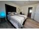 Bedroom featuring a plush bed, modern decor, and access to an ensuite bathroom at 4200 S Valley View Blvd # 3078, Las Vegas, NV 89103
