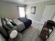 Comfortable bedroom with ample natural light, neutral decor, and wood-look flooring at 4200 S Valley View Blvd # 3078, Las Vegas, NV 89103