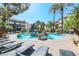 Beautiful community pool with rock waterfall feature and ample seating with lounge chairs at 4200 S Valley View Blvd # 3078, Las Vegas, NV 89103