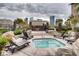 Inviting outdoor spa featuring lounge chairs, rock landscaping, and a nearby pergola at 4200 S Valley View Blvd # 3078, Las Vegas, NV 89103