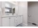 Bathroom featuring a double vanity, large mirror and modern fixtures at 4509 Paseo Del Ray Dr, Las Vegas, NV 89121
