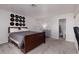 Bedroom featuring carpet floors, a bed, and easy access to an adjacent bathroom at 4509 Paseo Del Ray Dr, Las Vegas, NV 89121