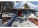 Charming single-story home features a red front door, gray exterior paint, and landscaped yard at 4509 Paseo Del Ray Dr, Las Vegas, NV 89121