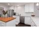 Modern kitchen with white cabinetry, stainless steel appliances, granite countertops, and a kitchen island at 4509 Paseo Del Ray Dr, Las Vegas, NV 89121