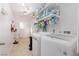 Spacious laundry room with tile floors and washer dryer hookups at 4509 Paseo Del Ray Dr, Las Vegas, NV 89121