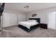 Comfortable main bedroom features large bed, carpeted floors, and plenty of closet space at 4509 Paseo Del Ray Dr, Las Vegas, NV 89121