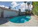Backyard pool with palm trees, patio area and privacy landscaping, perfect for outdoor relaxation at 4509 Paseo Del Ray Dr, Las Vegas, NV 89121