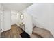 Welcoming entryway with wood-look tile flooring and stairs to the second floor at 4612 Townwall St, Las Vegas, NV 89115
