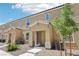 Charming townhome exterior with covered entrance, well-kept landscaping, and neutral-toned stucco at 4612 Townwall St, Las Vegas, NV 89115