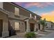 Charming townhouse exterior featuring desert landscaping and an inviting covered front porch at 4612 Townwall St, Las Vegas, NV 89115