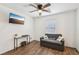 Comfortable living space with a sofa, window, and a mounted television for entertainment at 4612 Townwall St, Las Vegas, NV 89115