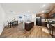 Bright and spacious open floor plan blending the kitchen, dining, and living areas seamlessly at 4612 Townwall St, Las Vegas, NV 89115