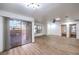 A spacious living room with hardwood floors, natural light, and a sliding glass door to the patio at 5101 Village Dr, Las Vegas, NV 89142