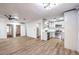 Spacious living area featuring light-colored floors and walls that seamlessly connect to the well-lit kitchen at 5101 Village Dr, Las Vegas, NV 89142