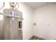 Utility room features a modern water heater and vinyl flooring at 5101 Village Dr, Las Vegas, NV 89142