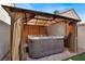 Relaxing backyard hot tub surrounded by a shaded gazebo and privacy drapes at 5762 Yerington Ave, Las Vegas, NV 89110