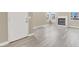 Bright living room featuring stylish gray wood flooring and fireplace at 5762 Yerington Ave, Las Vegas, NV 89110