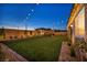 Manicured backyard showcasing lush grass, a charming gazebo, and tasteful landscaping for serene outdoor enjoyment at 6325 Gambetta St, Las Vegas, NV 89115