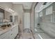 Luxurious bathroom boasting a double vanity, frameless glass shower, and contemporary fixtures, a spa-like experience at 6325 Gambetta St, Las Vegas, NV 89115