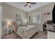 Bedroom with a work desk and a nightstand with a decorative lamp at 6325 Gambetta St, Las Vegas, NV 89115