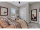 Bedroom featuring closet space, TV, and bright window at 6325 Gambetta St, Las Vegas, NV 89115
