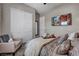 Inviting bedroom with a sliding closet and a plush armchair at 6325 Gambetta St, Las Vegas, NV 89115