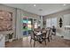 Cozy dining area with a stylish table setting, sliding glass doors, and elegant decor at 6325 Gambetta St, Las Vegas, NV 89115