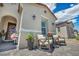 Charming home entrance featuring rocking chairs, potted plants, and stylish decor, offering a warm welcome at 6325 Gambetta St, Las Vegas, NV 89115