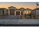Charming single-story home features a two-car garage and meticulously landscaped front yard, creating a welcoming curb appeal at 6325 Gambetta St, Las Vegas, NV 89115