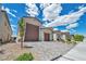Charming single-story home with a three-car garage, desert landscaping, and a welcoming front facade at 6325 Gambetta St, Las Vegas, NV 89115