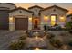 Beautiful single-story home with inviting entrance, desert landscaping, and a three-car garage at 6325 Gambetta St, Las Vegas, NV 89115