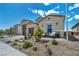 Inviting home exterior featuring desert landscaping, a cozy front porch with seating, and a well-maintained facade at 6325 Gambetta St, Las Vegas, NV 89115