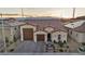 Beautiful single-story home with desert landscaping, a three-car garage, and a welcoming facade at 6325 Gambetta St, Las Vegas, NV 89115