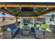 Inviting gazebo area with comfortable seating and a view of the green backyard at 6325 Gambetta St, Las Vegas, NV 89115